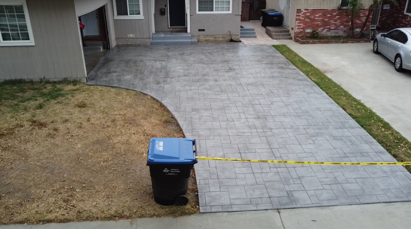 Decorative stamped concrete driveway with beautiful pattern in Pomona, CA
